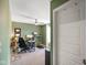 Green home office featuring a standing desk and an ergonomic office chair at 15813 Arthur Jacob Ln, Noblesville, IN 46060