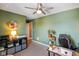 Inviting home office with ample lighting and ceiling fan to accommodate any home worker at 15813 Arthur Jacob Ln, Noblesville, IN 46060