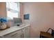 Compact office nook with a white countertop, storage cabinets, and a window at 15813 Arthur Jacob Ln, Noblesville, IN 46060