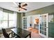 Bright office features an inviting layout, lots of natural light, and stylish French doors at 15813 Arthur Jacob Ln, Noblesville, IN 46060