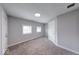 Bedroom featuring neutral gray walls, carpeted floors, recessed lighting, and bright windows at 1641 Deloss St, Indianapolis, IN 46201