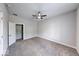 Bedroom with soft gray walls, carpeted floors, ceiling fan, and closet at 1641 Deloss St, Indianapolis, IN 46201