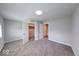 Spacious bedroom featuring neutral gray walls, carpeted floors and ample closet space at 1641 Deloss St, Indianapolis, IN 46201