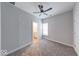 Bedroom with soft gray walls, carpeted floors, and a view of a well-lit bathroom at 1641 Deloss St, Indianapolis, IN 46201