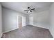 This bedroom has gray walls, neutral carpet and two white paneled doors at 1641 Deloss St, Indianapolis, IN 46201
