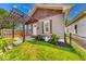 Charming home featuring a wooden pergola, neutral siding, and well-maintained front yard at 1641 Deloss St, Indianapolis, IN 46201