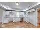 Modern kitchen featuring white cabinets, granite countertops, and stainless steel appliances at 1641 Deloss St, Indianapolis, IN 46201