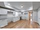 Modern kitchen featuring white cabinets, granite countertops, and stainless steel appliances at 1641 Deloss St, Indianapolis, IN 46201