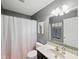 Bathroom featuring vanity, mirror, and a shower with pink curtain at 1680 Woodfield Dr, Greenwood, IN 46143