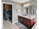Bathroom showcasing double sinks, vanity and a separate walk-in closet at 1680 Woodfield Dr, Greenwood, IN 46143