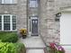 Inviting front entrance with decorative plants and a well-lit porch, number 1680 at 1680 Woodfield Dr, Greenwood, IN 46143