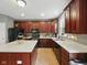 Well-lit kitchen with island, modern appliances, and ample cabinet space at 1680 Woodfield Dr, Greenwood, IN 46143