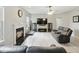Relaxing living room showcasing a fireplace, a ceiling fan, and comfortable seating at 1680 Woodfield Dr, Greenwood, IN 46143