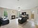 Cozy living room featuring a fireplace, TV, and comfortable leather furniture at 1680 Woodfield Dr, Greenwood, IN 46143