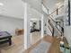 Open-concept living space with hardwood floors and a staircase leading to the second floor at 1680 Woodfield Dr, Greenwood, IN 46143