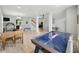 Spacious living area featuring hardwood floors, an air hockey table, and dining set at 1680 Woodfield Dr, Greenwood, IN 46143