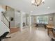 Bright and airy living space with natural light, stairs, and neutral paint colors at 1680 Woodfield Dr, Greenwood, IN 46143
