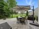 Outdoor patio with seating under a large umbrella, perfect for outdoor dining at 1680 Woodfield Dr, Greenwood, IN 46143