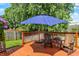 Outdoor deck with seating and an umbrella, offering a relaxing space at 17401 Austrian Pine Way, Westfield, IN 46074