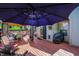 Outdoor deck furnished with two seating areas with an umbrella and gazebo at 17401 Austrian Pine Way, Westfield, IN 46074