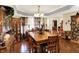 Charming dining room featuring a wooden table, chairs, and display cabinets at 17401 Austrian Pine Way, Westfield, IN 46074