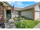 Inviting front yard with well-kept landscaping, flowers, and an American flag at 17401 Austrian Pine Way, Westfield, IN 46074