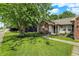 Charming home with well-manicured lawn, flowerbeds, and a cozy bench, inviting relaxation at 17401 Austrian Pine Way, Westfield, IN 46074