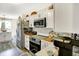 Modern kitchen with white cabinets, stainless steel appliances, and a sleek design at 17401 Austrian Pine Way, Westfield, IN 46074