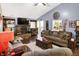 Spacious living room featuring a brick fireplace and wood flooring at 17401 Austrian Pine Way, Westfield, IN 46074