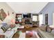 Inviting living room with a brick fireplace, TV, and comfortable seating at 17401 Austrian Pine Way, Westfield, IN 46074