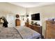 Comfortable main bedroom with soft carpet, furniture, and a large TV at 17401 Austrian Pine Way, Westfield, IN 46074