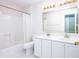 Clean bathroom featuring a double sink vanity, a large mirror, and a shower with tub at 1856 Misty Lake Dr, Indianapolis, IN 46260