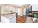 Well-appointed kitchen featuring granite countertops, sleek black appliances, hardwood floors and white cabinets at 1856 Misty Lake Dr, Indianapolis, IN 46260