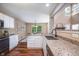 Bright kitchen features granite countertops, white cabinets, and stainless steel appliances at 1856 Misty Lake Dr, Indianapolis, IN 46260