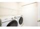 Bright laundry room featuring a Samsung washer and dryer with shelving at 1856 Misty Lake Dr, Indianapolis, IN 46260