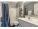 Cozy bathroom features a shower-tub combo and a modern sink with storage at 19469 Amber Way, Noblesville, IN 46060