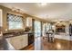 Open kitchen with dark countertops, white cabinets, and stainless steel appliances at 19469 Amber Way, Noblesville, IN 46060