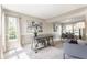 Sun-drenched living room featuring modern decor, plush carpet, and large windows at 19469 Amber Way, Noblesville, IN 46060