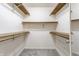 Spacious walk-in closet features multiple shelves for plenty of storage at 19469 Amber Way, Noblesville, IN 46060