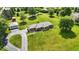 Sprawling property featuring a brick home, detached garage, and mature trees at 1981 N Valley Ln, Greenfield, IN 46140
