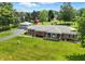 Beautiful brick home with lush lawn, detached garage, and circular driveway at 1981 N Valley Ln, Greenfield, IN 46140