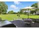 Enjoy outdoor living on this spacious deck with views of the expansive backyard and lush greenery at 1981 N Valley Ln, Greenfield, IN 46140