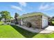 Brick home with an attached garage, patio, and beautiful landscaping at 1981 N Valley Ln, Greenfield, IN 46140