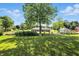 Spacious backyard featuring mature trees, garden, and a well-maintained lawn at 1981 N Valley Ln, Greenfield, IN 46140