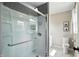 Updated bathroom with a glass shower enclosure, marble tile floor, and a neutral color palette at 1981 N Valley Ln, Greenfield, IN 46140