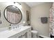 Charming bathroom with a floral shower curtain, decorative mirror, and a white vanity at 1981 N Valley Ln, Greenfield, IN 46140