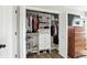 Organized walk-in closet with built-in shelving, drawers, and ample hanging space for clothes and shoes at 1981 N Valley Ln, Greenfield, IN 46140