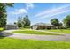 Well-maintained brick home with detached garage and spacious circular driveway at 1981 N Valley Ln, Greenfield, IN 46140