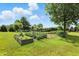 This property features a thriving garden with a variety of plants and vegetables, perfect for gardening enthusiasts at 1981 N Valley Ln, Greenfield, IN 46140