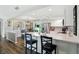 Open kitchen with marble countertops, white cabinets, and stainless steel appliances at 1981 N Valley Ln, Greenfield, IN 46140